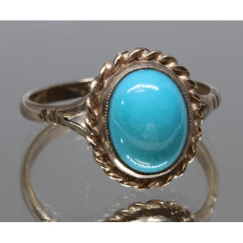 33 - A turquoise cabochon ring, rope twist border, marked '9ct', gross wt. 2.6g, size P.