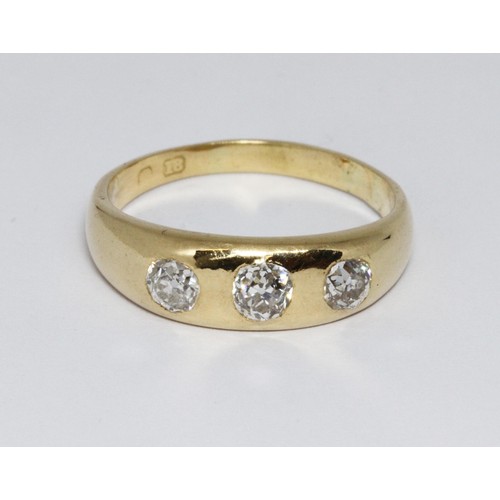51 - An antique three stone diamond ring, the old cut stones weighing approx. 0.30cts each, hallmarked 18... 