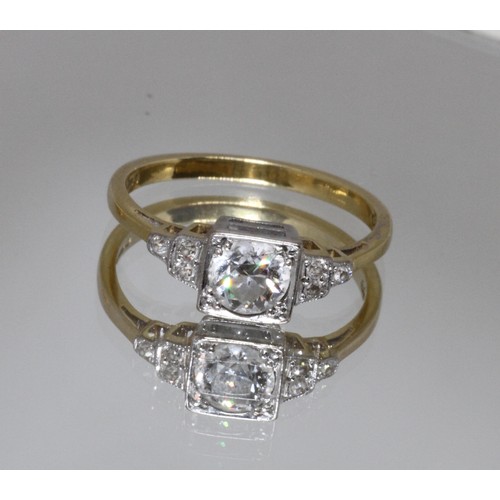55 - An Art Deco style diamond ring, the central stone weighing approx. 0.50cts, three melee diamonds to ... 