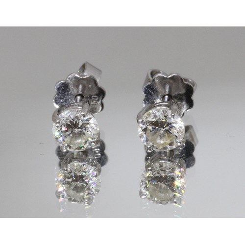 85 - A pair of diamond ear studs, each round brilliant cut stone weighing approx. 0.50cts, screw back but... 