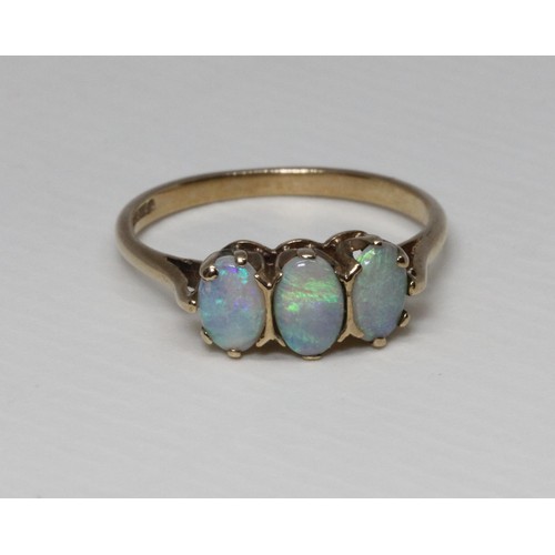 107 - A hallmarked 9ct gold three stone opal ring, gross weight 1.9g, size M.