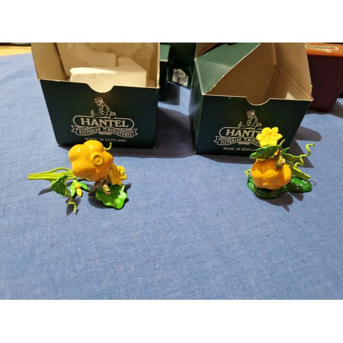 574 - A box of assorted Hantel Victorian Miniatures models, together with a stand and bound volumes of The... 