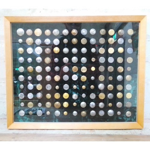 527 - A display case containing 130 transport uniform buttons, trams, railway, mainly Unite States, also i... 