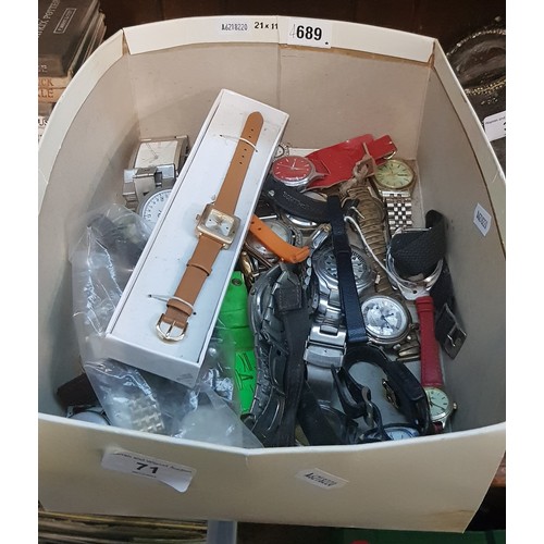 71 - A box of mixed ladies and gents wristwatches.