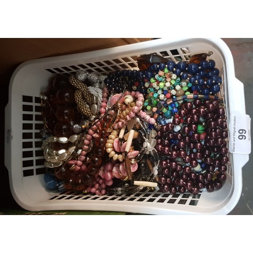 99 - A basket of costume jewellery including bead necklaces, etc.