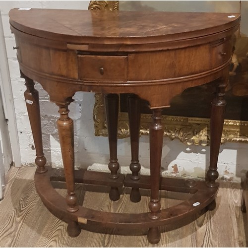 883 - A walnut demi-lune card table or credence table, circa 1700, with fold over top, three frieze drawer... 