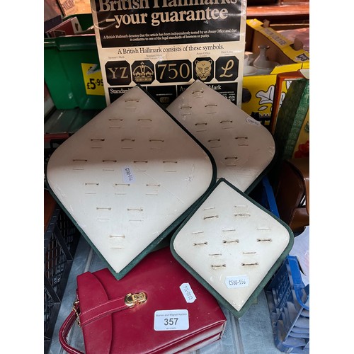 357 - Three vintage shop display ring stands together with a red leather jewellery case and a British hall... 