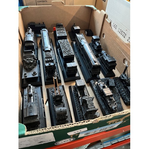 424 - A box of assorted train models made from coal