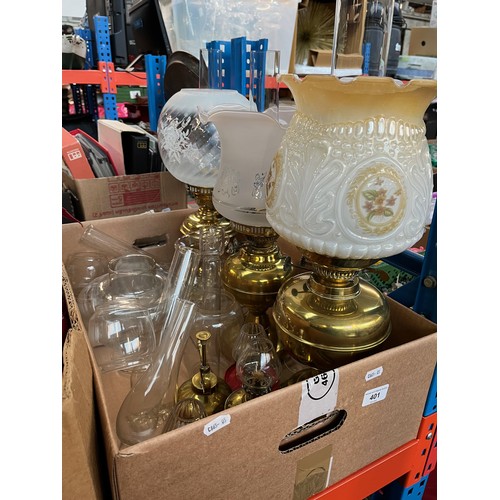 401 - Three brass oil lamps, three small oil lamps, spare oil lamp chimneys etc.