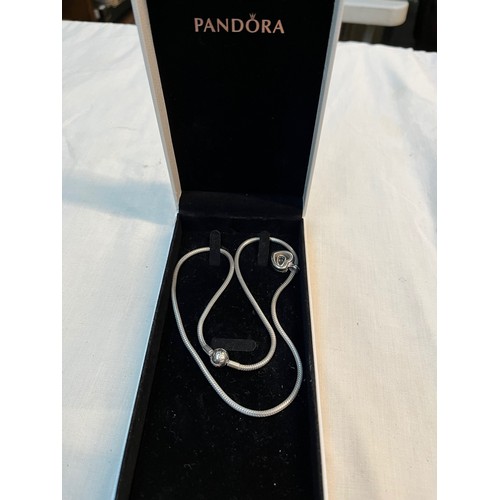 510 - A boxed Pandora silver necklace with heart pendant.