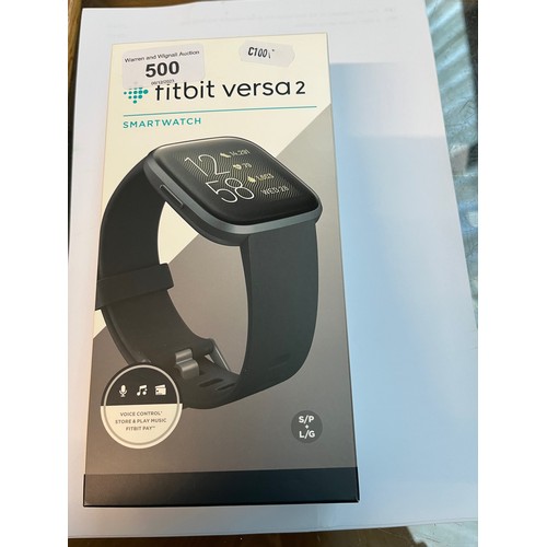 500 - A Fitbit Versa 2 boxed with plug and charger. Reset to factory settings