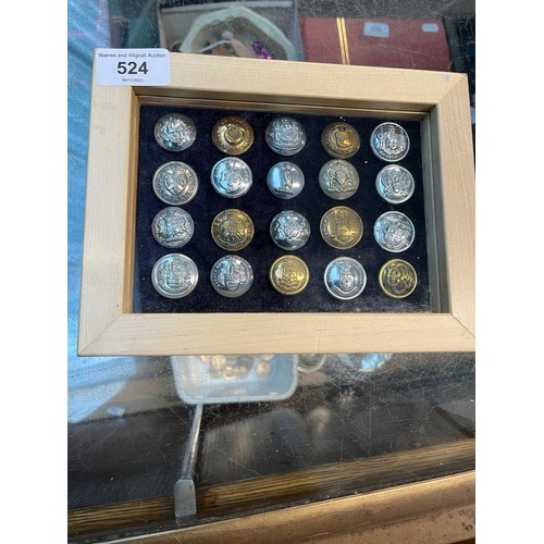 524 - A display case of 20 mainly British municipal transport buttons, some possible police.