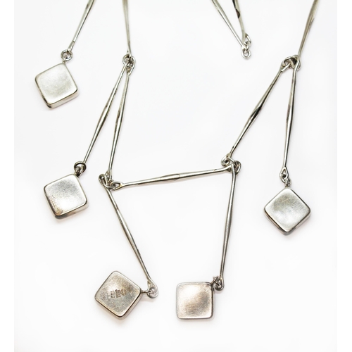 259 - A Georg Jensen silver necklace no. 123, designed by Astrid Fog, post 1945, formed from five silver c... 