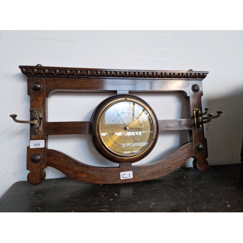 889 - An Edwardian oak coat rack/barometer.