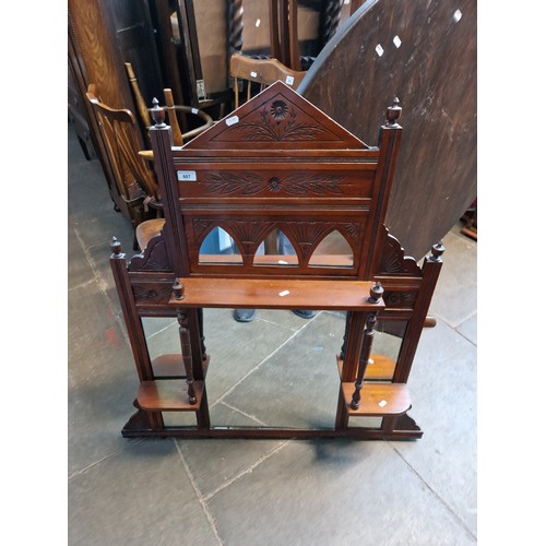 887 - An Edwardian walnut overmantle mirror.