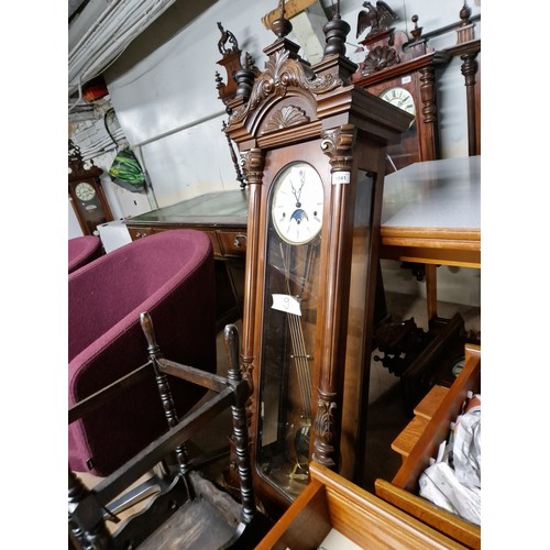 1041 - A large Kieninger Vienna wall clock with moon dial, complete with weights, pendulum and key.