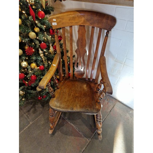 1068 - 19th century beech and elm rocking chair.