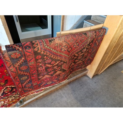 1074 - A vintage hand knotted Afghan wool carpet, 204 x 128cm appx