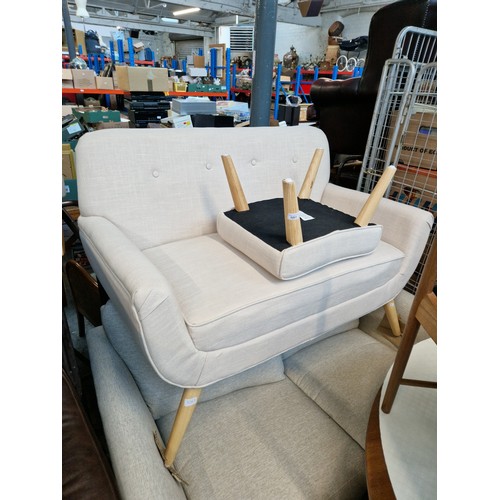 1061 - A modern cream 2 seater settee and matching footstool