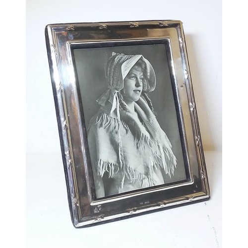 244 - A hallmarked silver photograph frame, height 25cm.