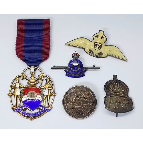 247 - Assorted badges and medals comprising a bone and horn winged brooch 'Mother' the reverse inscribed '... 