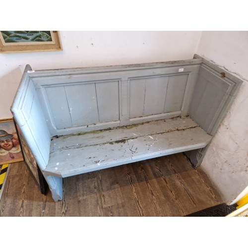 1087 - A 19th century painted church pew, width 132cm.