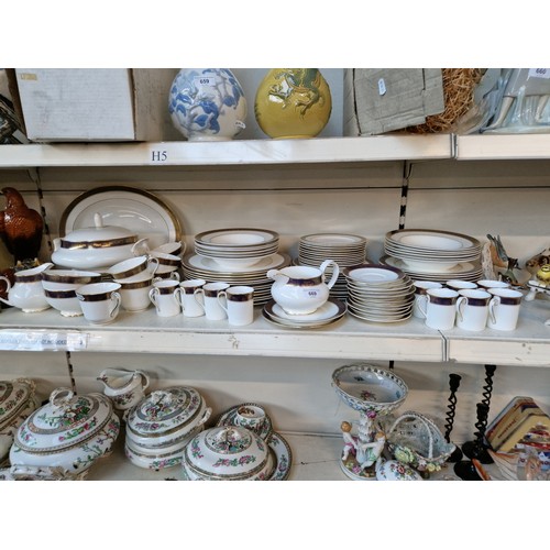 669 - A large quantity of Royal Doulton 'Rochelle' china including plates, soup bowls, tureen, gravy jug, ... 