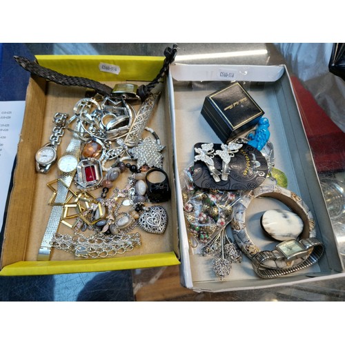 548 - Two trays of vintage costume jewellery and wristwatches.