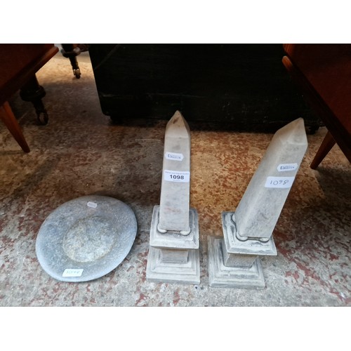 1098 - Two concrete obelisks and a stone dish.