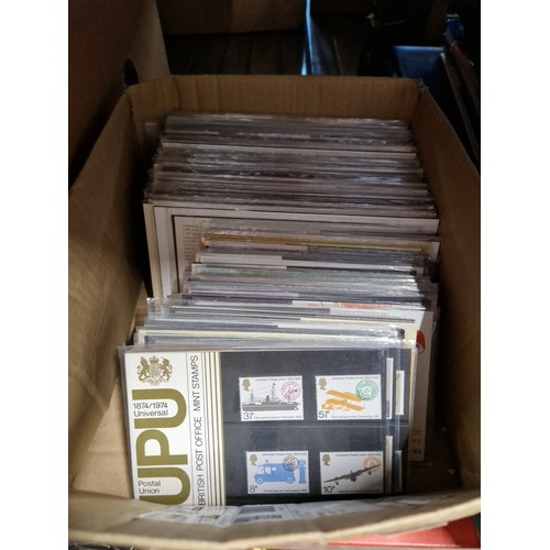 304 - A box of stamp presentation packs, approximately 115.