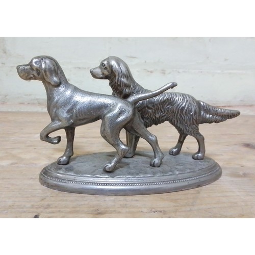 289 - A pair of silver plated dogs on base, length 19cm.