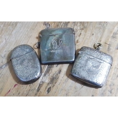 308 - A group of three hallmarked silver vesta cases.