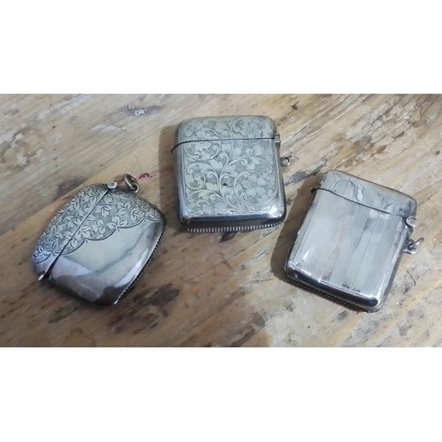 307 - A group of three hallmarked silver vesta cases.