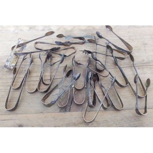 304 - Twenty six pairs of assorted hallmarked silver sugar tongs, gross weight 9.9ozt.