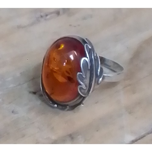 329 - A modern Art Nouveau style amber cabochon ring, marked '925', size L.