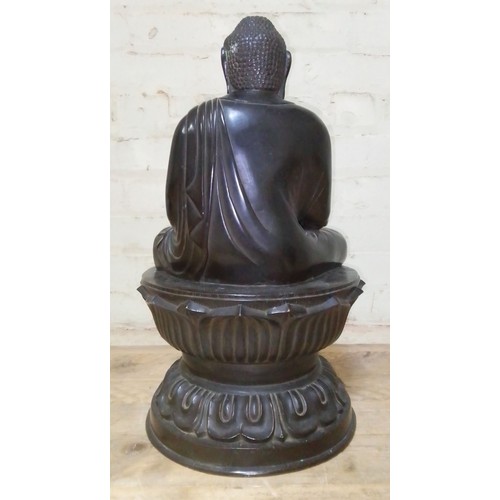 311 - A bronze Buddha, 18th/19th century, round lotus base, Chinese characters to inside foot rim, height ... 