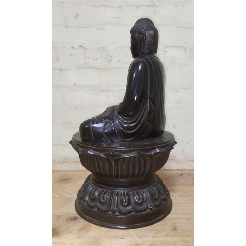 311 - A bronze Buddha, 18th/19th century, round lotus base, Chinese characters to inside foot rim, height ... 