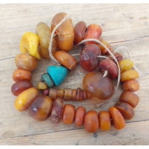 326 - Two amber bead necklaces, one also strung with an amazonite bead, weight 193g.