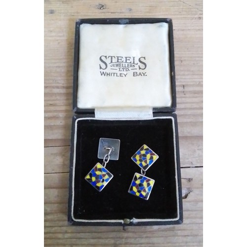 399 - A pair of enamel cufflinks, marked 'Regnum Sterling Silver', with associated box.