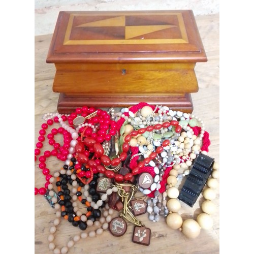 321 - A parquetry inlaid jewellery casket and contents including marbled cherry beads, etc.