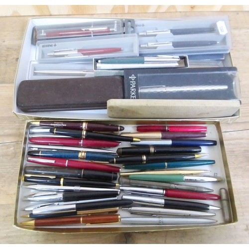 384 - Two trays of assorted vintage pens and pencils including fountain pens with 14ct nibs etc.