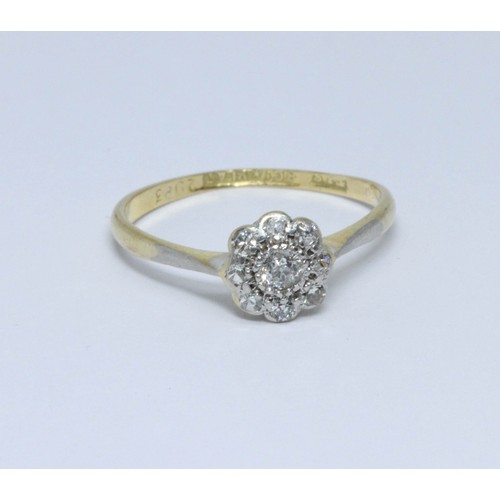 414 - An early 20th century diamond cluster ring, the band marked '18ct&PLAT', gross weight 1.8g, size N.