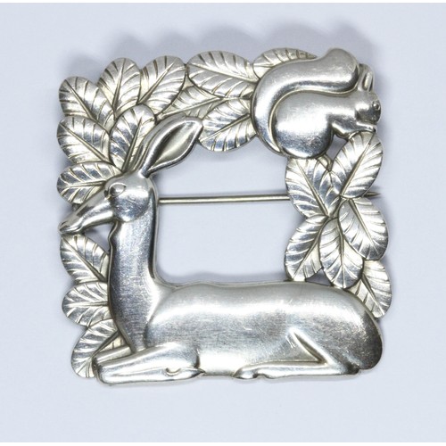 406 - A Georg Jensen silver deer and squirrel brooch, no. 318, 40mm x 40mm.