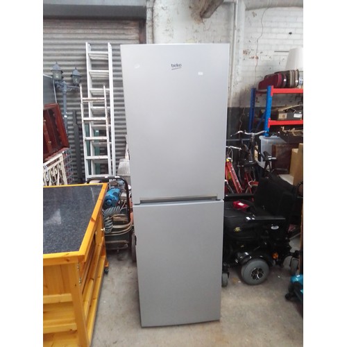 1100A - A Beko fridge freezer.