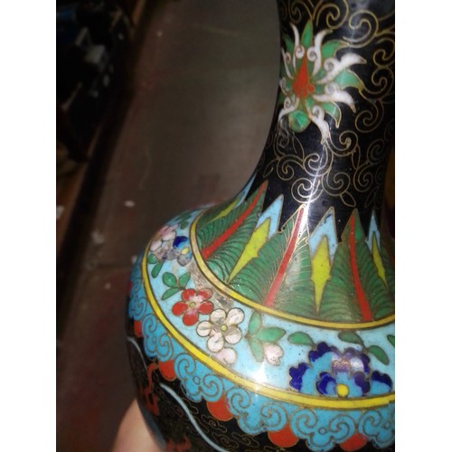 70 - A pair of Chinese cloisonne vases decorated with dragons, together with matching dish.