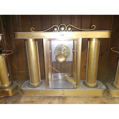 24 - A 1930s Art Deco mantle clock with electric lamp garnitures.