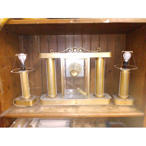 24 - A 1930s Art Deco mantle clock with electric lamp garnitures.