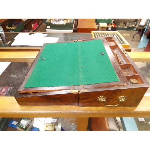 56 - A Victorian inlaid walnut writing box.