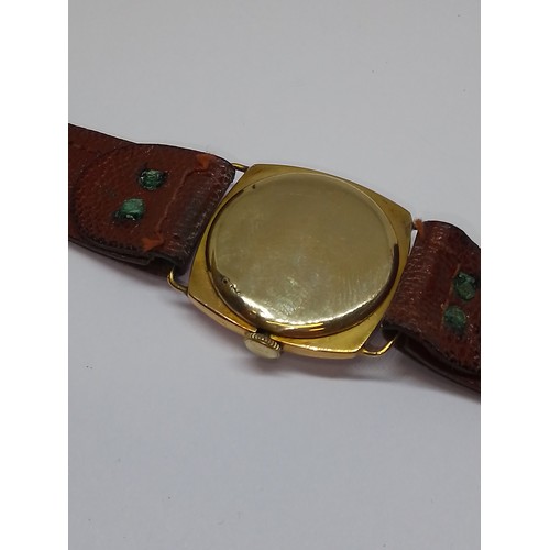 429 - A 9ct gold cased mechanical wristwatch, case width 27mm, leather strap.