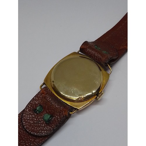 429 - A 9ct gold cased mechanical wristwatch, case width 27mm, leather strap.